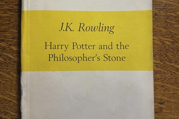 This undated photo issued by Hansons Auctioneers on Monday Feb. 26, 2024, shows a first edition Harry Potter novel. The proof copy of the first Harry Potter novel that was bought for pennies in a second-hand bookshop almost 30 years ago has sold at auction for more than 10,000 pounds, or $12,700. British auctioneers Hanson’s said Monday Feb. 26, 2024, that the first-edition copy of “Harry Potter and the Philosopher’s Stone,” which states “uncorrected proof copy” on the cover, was bought in 1997 from a shop in south London with two other books for a total of 40 pence ($0.50). (Hansons Auctioneers via AP)