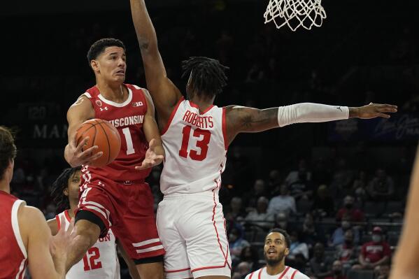 Wisconsin guard Johnny Davis drives on Houston forward J'Wan Roberts (13) in the first half during an NCAA college basketball game at the Maui Invitational in Las Vegas, Tuesday, Nov. 23, 2021. (AP Photo/Rick Scuteri)