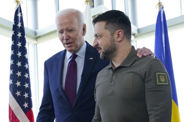 FILE - President Joe Biden, left, walks with Ukrainian President Volodymyr Zelenskyy ahead of a working session on Ukraine during the G7 Summit in Hiroshima, Japan, on May 21, 2023. Russia's war on Ukraine will top the agenda when U.S. President Joe Biden and his NATO counterparts meet in the Lithuanian capital Vilnius on Tuesday and Wednesday. (AP Photo/Susan Walsh, File)