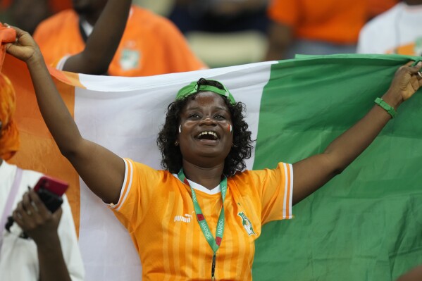 An Ivory Coast supporter reacts before the African Cup of Nations semifinal soccer match between Ivory Coast and DR Congo, at the Olympic Stadium of Ebimpe in Abidjan, Ivory Coast, Wednesday, Feb. 7, 2024. (AP Photo/Sunday Alamba)