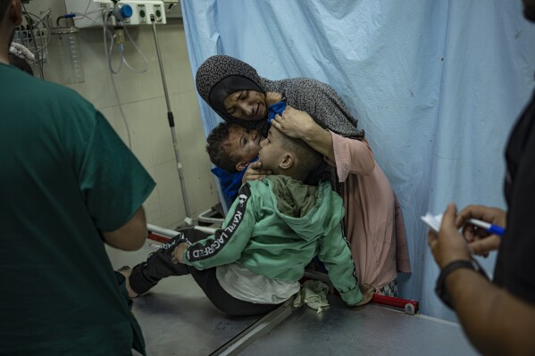 Palestinians wounded in an Israeli bombardment of the Gaza Strip are brought to a hospital in Khan Younis, Wednesday, Nov. 15, 2023. (AP Photo/Fatima Shbair)