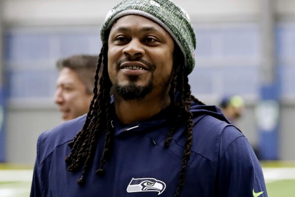 FILE - Seattle Seahawks running back Marshawn Lynch walks off the field after NFL football practice in Renton, Wash., Dec. 27, 2019. Former NFL running back Marshawn Lynch resolved a drunken driving case without a trial on Wednesday, Feb. 21, 2024 by agreeing to attend DUI traffic school for being found asleep 18 months ago in the driver's seat of a damaged luxury sports car in Las Vegas.(AP Photo/Ted S. Warren, File)