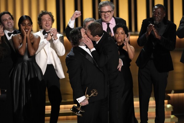 Matty Matheson, center, and Ebon Moss-Bachrach kiss as 