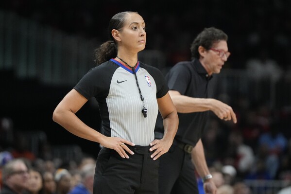 FILE - Referee Ashley Moyer-Gleich (13) waits for play during the first half of an NBA basketball game between the Atlanta Hawks and the New York Knicks, Friday, Oct. 27, 2023, in Atlanta. The NBA announced its first-round playoff referees on Friday, April 18, 2024, and Ashley Moyer-Gleich became the first woman selected for the postseason since 2012. Moyer-Gleich got the nod in her sixth NBA season.(AP Photo/Mike Stewart, File)