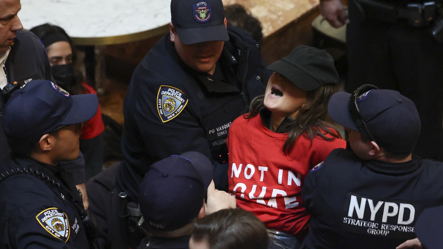 Jewish protesters flood Trump Tower's lobby to demand the Columbia University activist's release