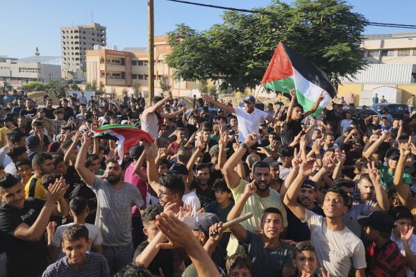 Palestinian demonstrators chant slogans during a protest against the territory's chronic power outages and difficult living conditions along the streets of Khan Younis, southern Gaza Strip, Sunday, July 30, 2023. Several thousand people briefly took to the streets across the Gaza Strip chanting "what a shame" and in one place burning Hamas flags, before police moved in and broke up the protests. (AP Photo)