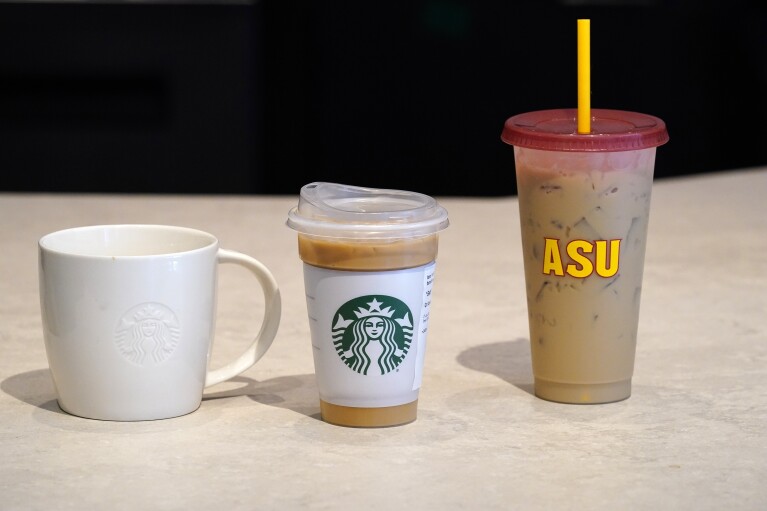 Different kind of reusable cups are displayed at an Arizona State University Starbucks shop Wednesday, June 7, 2023, in Tempe, Ariz. (AP Photo/Ross D. Franklin)
