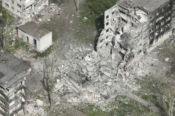 This photo taken from a drone video provided by Ukraine Patrol Police, shows devastation in Chasiv Yar, an eastern Ukrainian city Russia is assaulting, Ukraine, Monday, April 29, 2024. The footage shows the community of Chasiv Yar - which is set amid green fields and woodland - reduced to a skeletal ghost town with few residents left. The apocalyptic scene is reminiscent of the cities of Bakhmut and Avdiivka, which Ukraine yielded after months of bombardment and huge losses for the Kremlin’s forces. (Ukraine Patrol Police via AP)