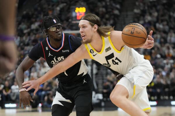 Kelly Olynyk of the Utah Jazz shoots in the game against the Denver