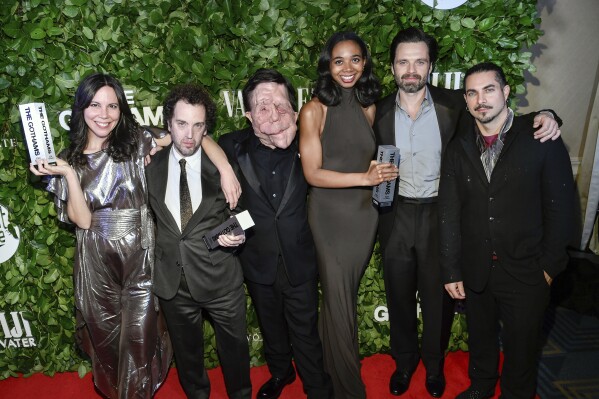From left, Vanessa McDonnell, Aaron Schimberg, Adam Pearson, Gabriel Mayers, Sebastian Stan and Mike Marino pose with the best feature award for "A Different Man" during The Gothams Film Awards at Cipriani Wall Street on Monday, Dec. 2, 2024, in New York. (Photo by Evan Agostini/Invision/AP)
