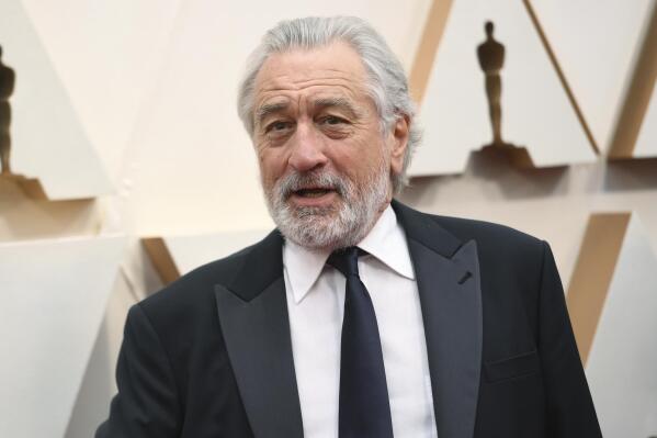 FILE - Robert De Niro appears at the Oscars in Los Angeles on Feb. 9, 2020. A leg injury may keep De Niro from celebrating the 20th Anniversary of the Tribeca Film Festival in person. The accident happened last week in Oklahoma while on location for the upcoming Martin Scorsese film, “Killers of the Flower Moon.” (Photo by Richard Shotwell/Invision/AP, File)