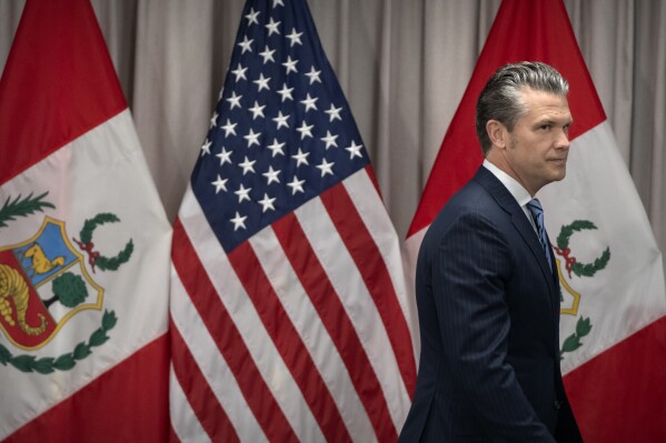 Secretary of Defense Pete Hegseth arrives for a meeting with Peru's Foreign Affairs Minister Elmer Schialer and Peru's Minister of Defense Walter Astudillo at the Pentagon, Monday, May 5, 2025, in Washington. (AP Photo/Mark Schiefelbein)
