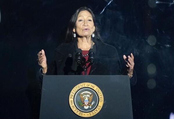 FILE - Interior Secretary Deb Haaland speaks at the Ellipse near the White House, Thursday, Dec. 2, 2021, in Washington. Federal officials have come up with a list of potential replacement names for hundreds of geographic features in three dozen states that include the word "squaw." Haaland in November formally declared the term derogatory and initiated a process to remove the term from use by the federal government and to replace other existing derogatory place names. The list was announced Tuesday, Feb. 22, 2022. (AP Photo/Andrew Harnik,File)