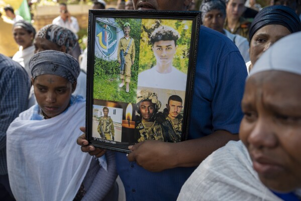 Family of Israeli solider Sergeant Yosef Dassa mourn in grief during his funeral in Kiryat Ata, Israel, Sunday, May 12, 2024. Dassa ,19, was killed during Israel's ground operation in the Gaza Strip, where the Israeli army has been battling Palestinian militants in the war ignited by Hamas' Oct. 7 attack into Israel. (AP Photo/Ariel Schalit)