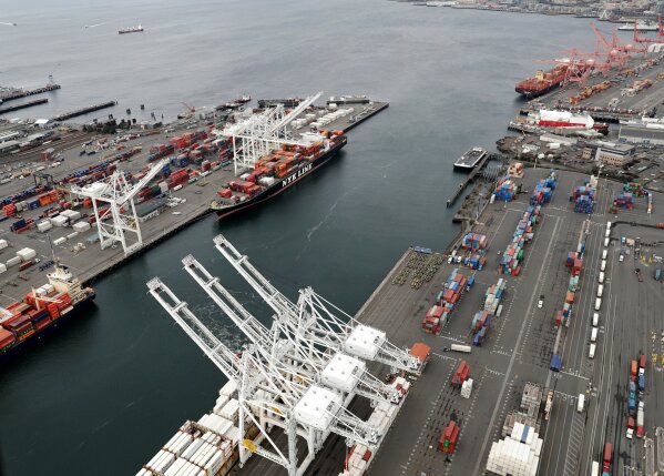 
              FILE- This Feb. 23, 2018, file photo shows cargo cranes at the Port of Seattle in Seattle.  The path to peace in a trade war between the United States and China is getting harder to find as the world's two biggest economies pile ever more taxes on each other's products. (AP Photo/Ted S. Warren, File)
            