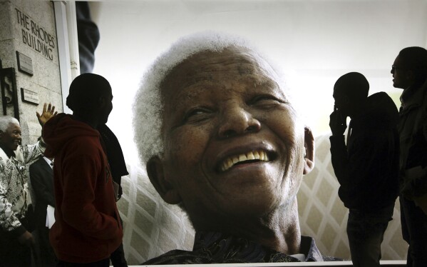 File — A photo of former South African President Nelson Mandela on display at the Nelson Mandela Legacy Exhibition in Cape Town, South Africa, on June 27, 2013. Today the ruling African National Congress (ANC) faces growing dissatisfaction from many who feel it has failed to live up to its promises. (AP Photo, File)