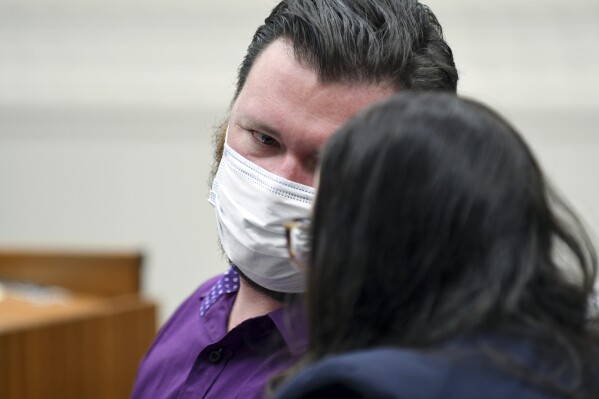 Miles Harford appears in court to hear the charges against him on Friday, March 8, 2024, in Denver. Harford, a former funeral home owner accused of keeping a woman's corpse in the back of a hearse for two years and hoarding the cremated remains of 35 people, has been charged with forgery, theft and abuse of a corpse. (AP Photo/Thomas Peipert, Pool)