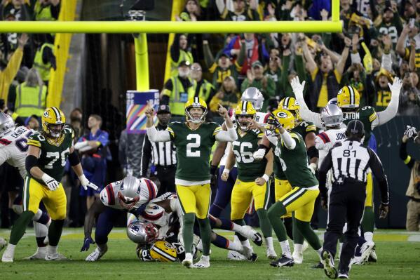 Green Bay Packers place kicker Mason Crosby (2) celebrates after kicking a 31-yard field goal during overtime in an NFL football game against the New England Patriots, Sunday, Oct. 2, 2022, in Green Bay, Wis. The Packers won 27-24. (AP Photo/Mike Roemer)
