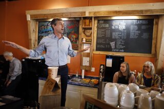 
              FILE - In this March 15, 2019, file photo, Democratic presidential candidate Beto O'Rourke speaks to local residents during a stop at the Central Park Coffee Company in Mount Pleasant, Iowa. Young voters, many of whom reside in delegate-rich areas of the state and can be powerful multiplying forces if they’re engaged enough to convince friends and family members to show up and support their candidates, could be a major force in this cycle’s Iowa caucuses. (AP Photo/Charlie Neibergall)
            