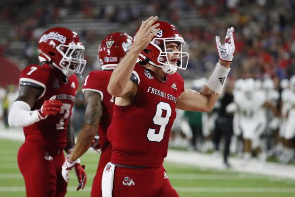 Fresno State quarterback Jake Haener celebrates a touchdown against Cal Poly during the first half of an NCAA college football game in Fresno, Calif., Thursday, Sept. 1, 2022. (AP Photo/Gary Kazanjian)