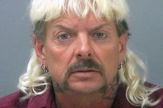 FILE - This undated file photo provided by the Santa Rose County Jail in Milton, Fla., shows Joseph Maldonado-Passage, also known as Joe Exotic. The "Tiger King" zookeeper-turned-reality-TV-star, who is now serving a 22-year federal prison sentence in Texas, was not included on the list announced Wednesday, Jan. 20, 2021, of pardons by President Trump as his team expected. (Santa Rosa County Jail via AP, File)
