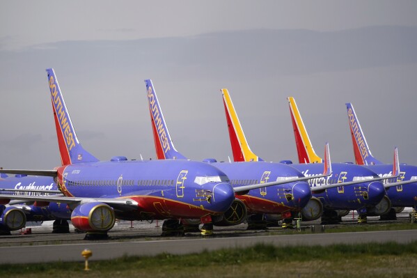 FILE - A line of Southwest Air Boeing 737 jets are parked near the company's production plant while being stored at Paine Field Friday, April 23, 2021, in Everett, Wash. Southwest Air reports earnings on Thursday, April 25, 2024. (AP Photo/Elaine Thompson, File)