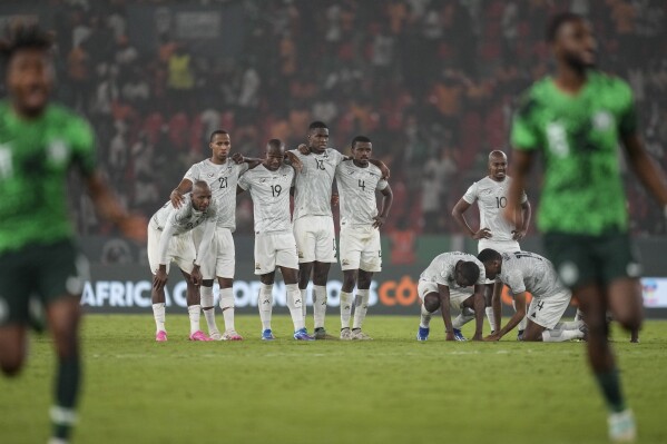 South Africa's players are dejected after losing the penalty shootout during the African Cup of Nations semifinal soccer match between Nigeria and South Africa, at the Peace of Bouake stadium in Bouake Bouake, Ivory Coast, Wednesday, Feb. 7, 2024. (AP Photo/Themba Hadebe)