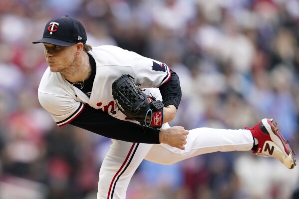 Minnesota Twins pitcher Sonny Gray works against the Toronto Blue Jays during the first inning of Game 2 of an AL wild-card baseball playoff series Wednesday, Oct. 4, 2023, in Minneapolis. (AP Photo/Abbie Parr)