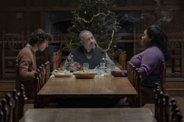 This image released by Focus Features shows, from left, Dominic Cessa, Paul Giamatti and Da'Vine Joey Randolph in a scene. "Holdover." (Cesia Pavao/Focus Features via AP)