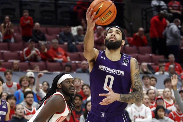 Northwestern guard Boo Buie, right, hoots in front of Ohio State guard Isaac Likekele during the first half of an NCAA college basketball game in Columbus, Ohio, Thursday, Feb. 9, 2023. (AP Photo/Paul Vernon)