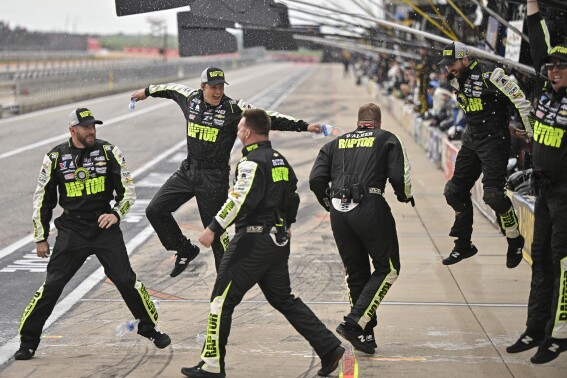 Members of William Byron's crew celebrate his win after a NASCAR Cup Series auto race on Sunday, March 24, 2024, at Circuit of the Americas in Austin, Texas. (AP Photo/Darren Abate)