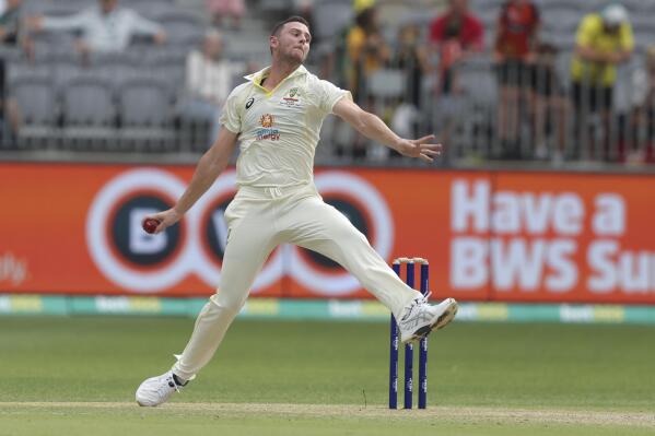 Australia's Josh Hazlewood bowls during play on the second day of the first cricket test between Australia and the West Indies in Perth, Australia, Thursday, Dec. 1, 2022. (AP Photo/Gary Day)