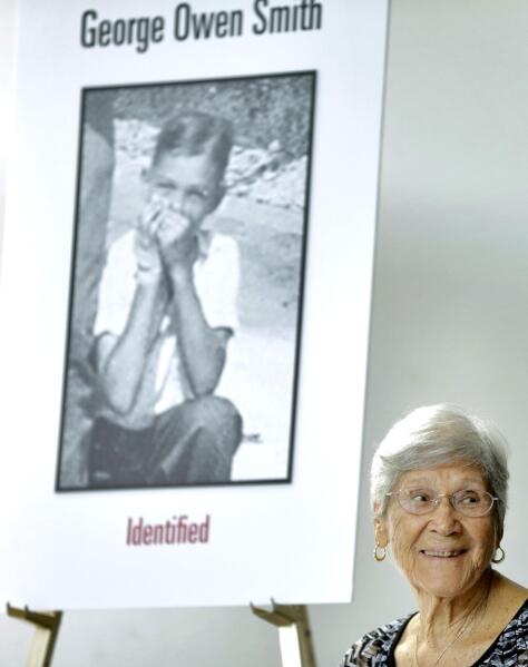 Ovell Krell, sister of George Owen Smith, the first victim positively identified from one of the 55 unmarked graves the former Arthur G. Dozier School for Boys in Marianna, Fla., smiles as she listens during a news conference Thursday, Aug. 7, 2014, at the University of South Florida in Tampa, Fla.  University researchers will exhume Smith's remains and return them to his family. Smith was 14 when he was sent to the school in 1940, and was never seen alive by his family again. (AP Photo/Chris O'Meara)