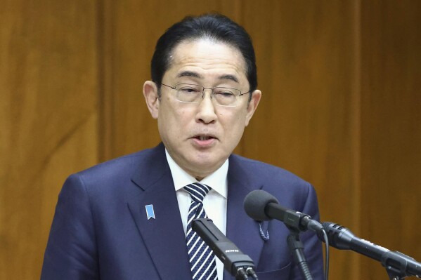 Japan's Prime Minister Fumio Kishida speaks about his governing party’s corruption scandal during a political ethics committee at parliament in Tokyo Thursday, Feb. 29, 2024. (Japan Pool/Kyodo News via AP)
