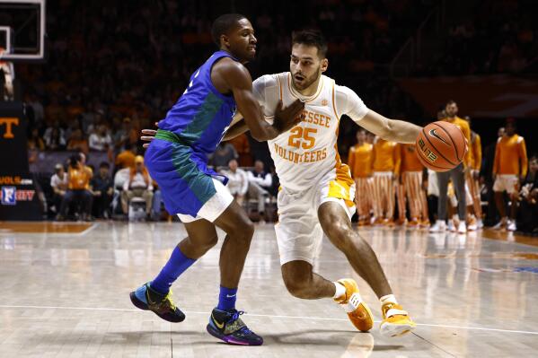 Tennessee guard Santiago Vescovi (25) drives against Florida Gulf Coast guard Isaiah Thompson during the first half of an NCAA college basketball game Wednesday, Nov. 16, 2022, in Knoxville, Tenn. (AP Photo/Wade Payne)