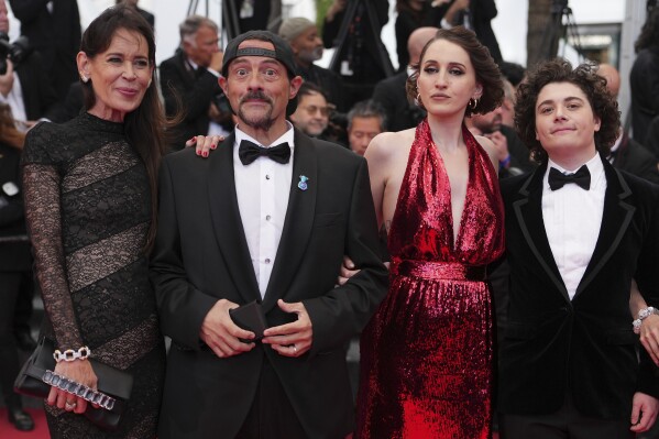 Jennifer Schwalbach Smith, from left, Kevin Smith, Harley Quinn Smith and Austin Zajur pose for photographers upon arrival at the premiere of the film 'Colours of Time' at the 78th international film festival, Cannes, southern France, Thursday, May 22, 2025. (Photo by Lewis Joly/Invision/AP)