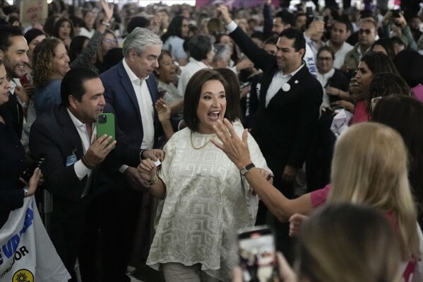 FILE - Opposition presidential candidate Xochitl Galvez greets supporters during a campaign rally in Huixquilucan, Mexico, April 11, 2024. (AP Photo/Marco Ugarte, File)