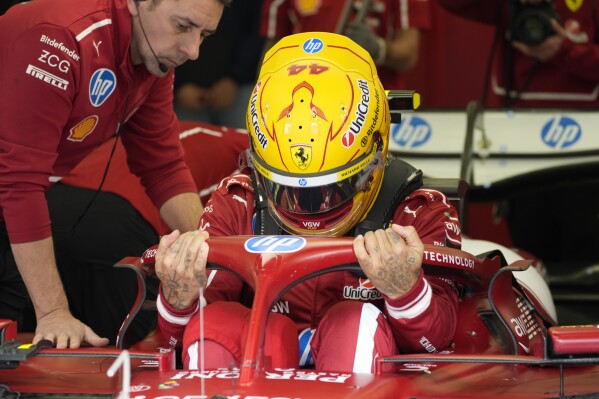 Ferrari driver Lewis Hamilton of Britain gets ready during a Formula One pre-season test at the Bahrain International Circuit in Sakhir, Bahrain, Friday, Feb. 28, 2025. (AP Photo/Darko Bandic)