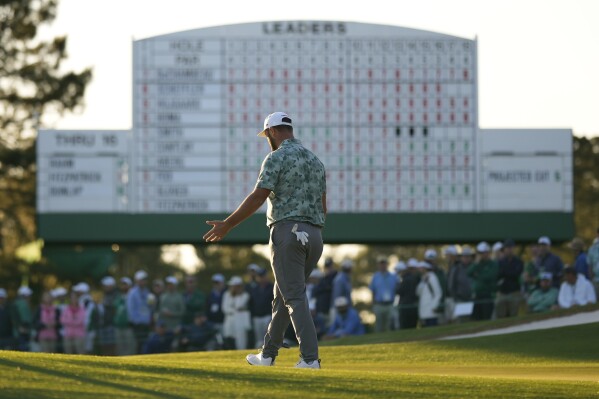 Jon Rahm, of Spain, reacts after missing a putt on the 17th hole during second round at the Masters golf tournament at Augusta National Golf Club Friday, April 12, 2024, in Augusta, Ga. (AP Photo/Matt Slocum)