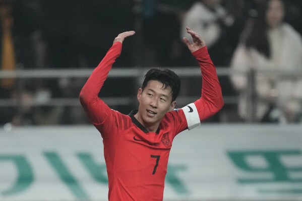 South Korea's Son Heung-min celebrates after scoring his side's third goal during the second round of the Asian qualifier group C match for 2026 World Cup between South Korea and Singapore at Seoul World Cup Stadium in Seoul, South Korea, Thursday, Nov. 16, 2023. (AP Photo/Lee Jin-man)
