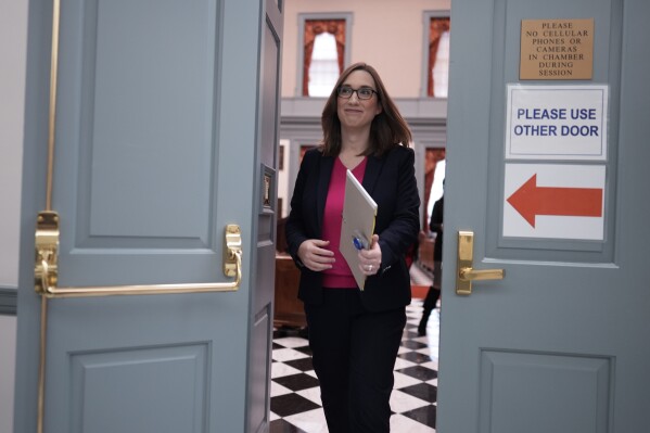 U.S.-Rep.-elect Sarah McBride, D-Del., walks from the Senate floor on her last day as a Delaware state senator at the Delaware Legislative Hall in Dover, Del., Monday, Dec. 16, 2024. (AP Photo/Carolyn Kaster)