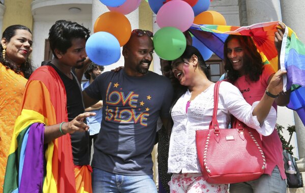 
              Members of the LGBT community and their supporters celebrate after the country's top court struck down a colonial-era law that made homosexual acts punishable by up to 10 years in prison, in Bangalore, India, Thursday, Sept. 6, 2018. The court gave its ruling Thursday on a petition filed by five people who challenged the law, saying they are living in fear of being harassed and prosecuted by police. (AP Photo/Aijaz Rahi)
            