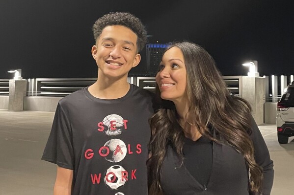 In this undated photo provided by Megan Garcia of Florida in October 2024, she stands with her son, Sewell Setzer III. (Courtesy Megan Garcia via AP, File)