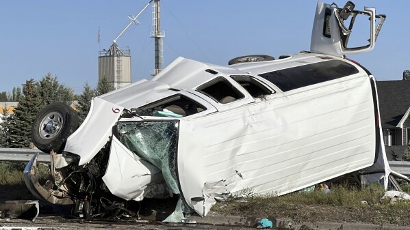In this file photo provided by KIFI Local News 8, a pickup truck crashed into a passenger van on U.S. Highway 20, Saturday, May 18, 2024, in Idaho Falls, Idaho. The six people killed when a pickup crashed into a passenger van in Idaho over the weekend were agricultural workers from Mexico, officials said. (Jeff Roper/KIFI Local News 8 via AP, File)