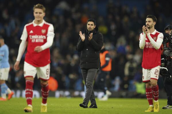 Arsenal's manager Mikel Arteta walks at the end of the English FA Cup 4th round soccer match between Manchester City and Arsenal at the Etihad Stadium in Manchester, England, Friday, Jan. 27, 2023. Manchester City won 1-0. (AP Photo/Dave Thompson)