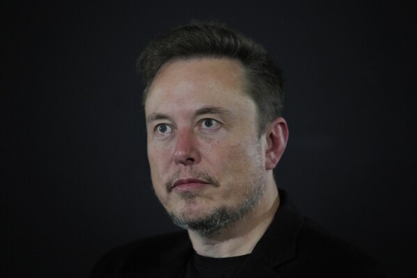 FILE - Tesla and SpaceX's CEO Elon Musk looks on, during an in-conversation event with Britain's Prime Minister Rishi Sunak at Lancaster House in London, Thursday, Nov. 2, 2023. Musk, who's been under fire over accusations of antisemitism flourishing on his social media platform X, paid a visit Monday, Nov. 27, 2023 to Israel, where he toured a kibbutz that was attacked last month by Hamas militants and was set to meet with top leaders. (AP Photo/Kirsty Wigglesworth, Pool, File)