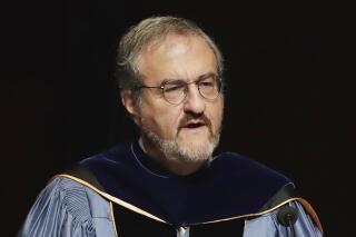 FILE - In this Jan. 30 2017, file photo, University of Michigan President Mark Schlissel speaks during a ceremony at the university, in Ann Arbor, Mich. Schlissel said Tuesday, Oct. 5, 2021, that he will step down in June 2023, a year before his contract expires. Schlissel, 63, has been president of the school since 2014. (AP Photo/Carlos Osorio, File)