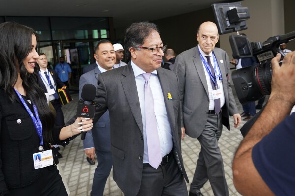 Colombia President Gustavo Petro walks through the COP28 U.N. Climate Summit, Saturday, Dec. 2, 2023, in Dubai, United Arab Emirates. (AP Photo/Joshua A. Bickel)