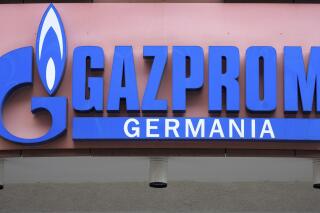 FILE - The logo of 'Gazprom Germania' is pictured at the company's headquarters in Berlin, April 6, 2022. Russian state-controlled energy giant Gazprom says gas deliveries through a key pipeline to Europe will drop by around 40% this year. The dpa news agency reports Tuesday, June 14 that Germany’s utility network agency said it didn't see gas supplies as endangered and that reduced amounts through the Nord Stream 1 pipeline under the Baltic Sea aligned with commercial behavior and the previously announced cutoff of gas to Denmark and the Netherlands. (AP Photo/Michael Sohn, File)
