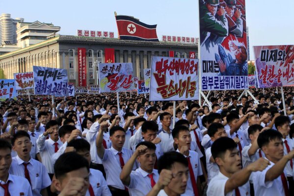 
              Tens of thousands of North Koreans gathered for a rally at Kim Il Sung Square carrying placards and propaganda slogans as a show of support for their rejection of the United Nations' latest round of sanctions on Wednesday Aug. 9, 2017, in Pyongyang, North Korea. (AP Photo/Jon Chol Jin)
            